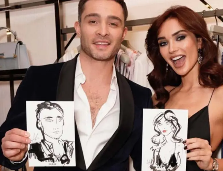 Ed Westwick and Amy Jackson holding their live portraits